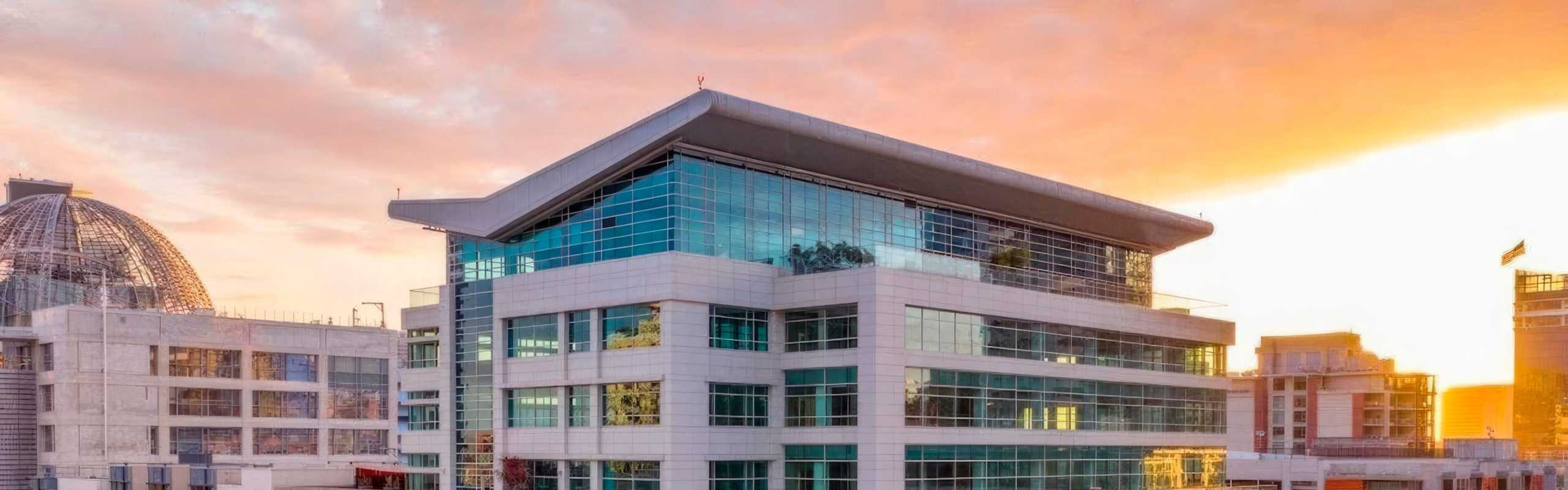 Group of colleagues greeting each other in a stylized blue duotone treatment