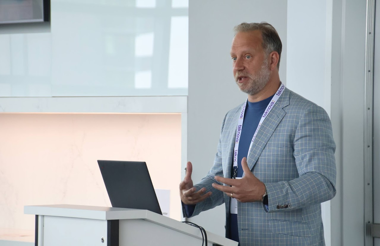 Stylized blue duotone portrait of a woman with long hair facing slightly backward